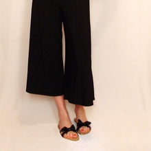 Load image into Gallery viewer, These are a summertime staple + a travelbug&#39;s favorite. The classic midi gaucho for everyday! Featuring a wide fitted style waistband that can be worn up for a high rise look or folded over for a low rise look. These 3/4 length wide leg flared gaucho&#39;s also feature our Signature mini leather heart on the top edge of the back waistband. Pair up these classics with any t-shirt + one of our ponchos for a favorite go-to look!
