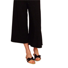 Load image into Gallery viewer, These are a summertime staple + a travelbug&#39;s favorite. The classic midi gaucho for everyday! Featuring a wide fitted style waistband that can be worn up for a high rise look or folded over for a low rise look. These 3/4 length wide leg flared gaucho&#39;s also feature our Signature mini leather heart on the top edge of the back waistband. Pair up these classics with any t-shirt + one of our ponchos for a favorite go-to look!
