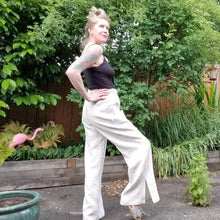 Load image into Gallery viewer, A classic super relaxed fit wide leg flare pant for the everyday. Featuring an elasticized waist with drawstring, patch pockets and high hem slits. Designed for the days spent lounging around the house, playing in the garden, reading a good book + working in your home office, these pants are so versatile. Feel the comfort in this style + the freedom to do it!
