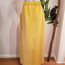 Load image into Gallery viewer, A classic super relaxed fit skirt for the everyday. Featuring an elasticized waist with a drawstring, patch pockets and double side slits at hem. Designed for the days spent lounging around the house, playing in the garden, reading a good book + working in your home office, this skirt is so versatile. Feel the comfort in this style + the freedom to do it!
