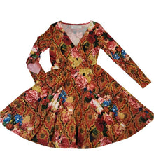 Load image into Gallery viewer, A classic swing dress for everyday! Made in a rich red and gold tone rose print silky knit and featuring a V-neck front, fitted waist and a semi full skirt. It had side pockets and fitted sleeves featuring heart shaped elbow patches in a pearlized pink leather.
